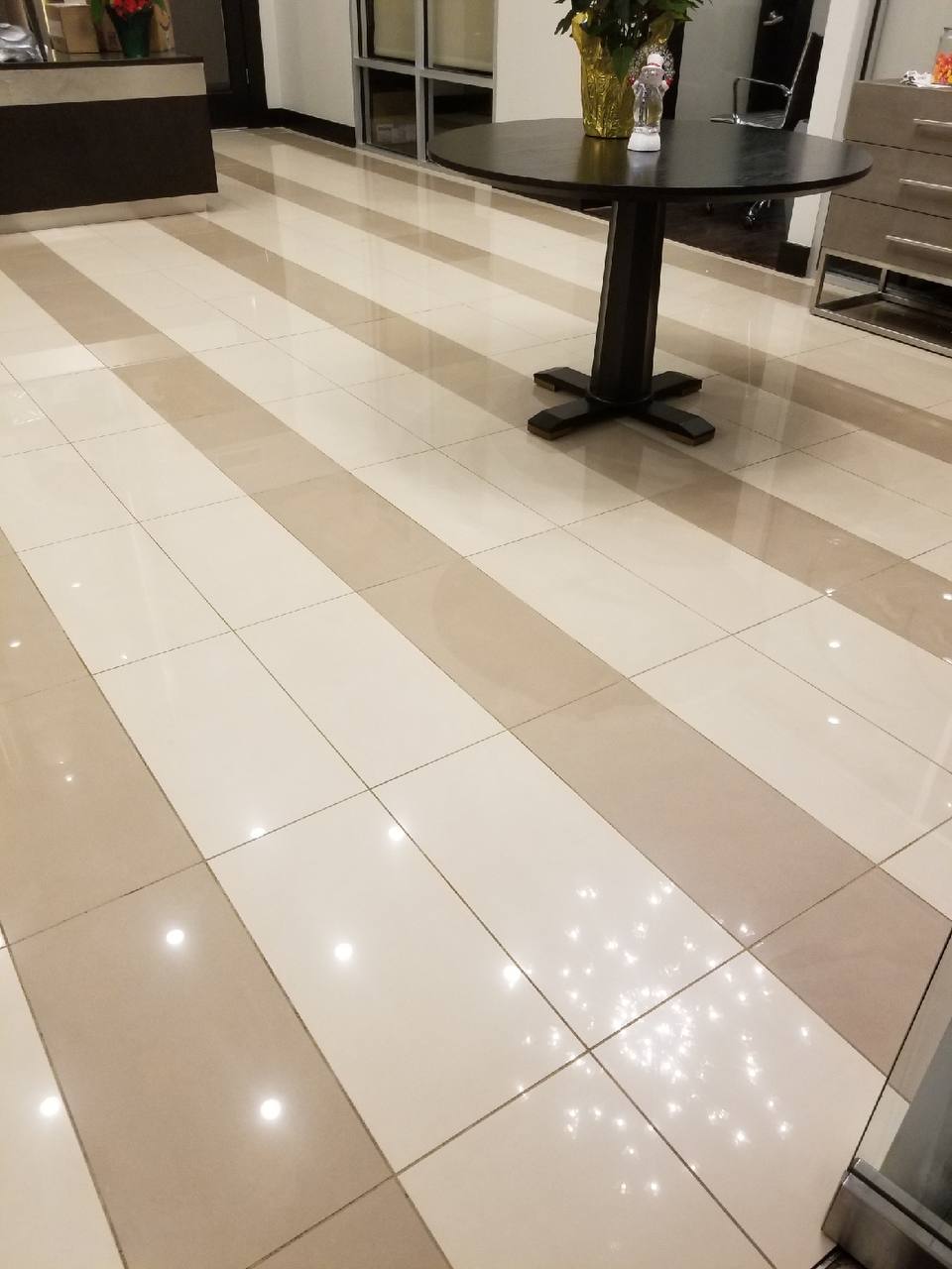 Freshly cleaned commercial lobby tile floor with bright, restored grout lines — Scott's Carpet Care in Humble, TX