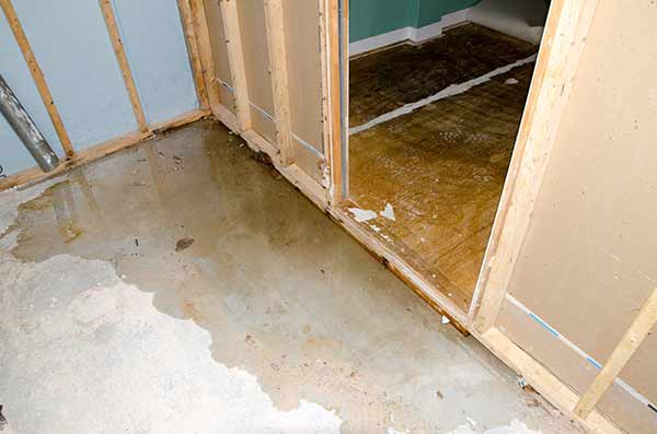Flood damage cleanup with industrial pumps and dehumidifiers