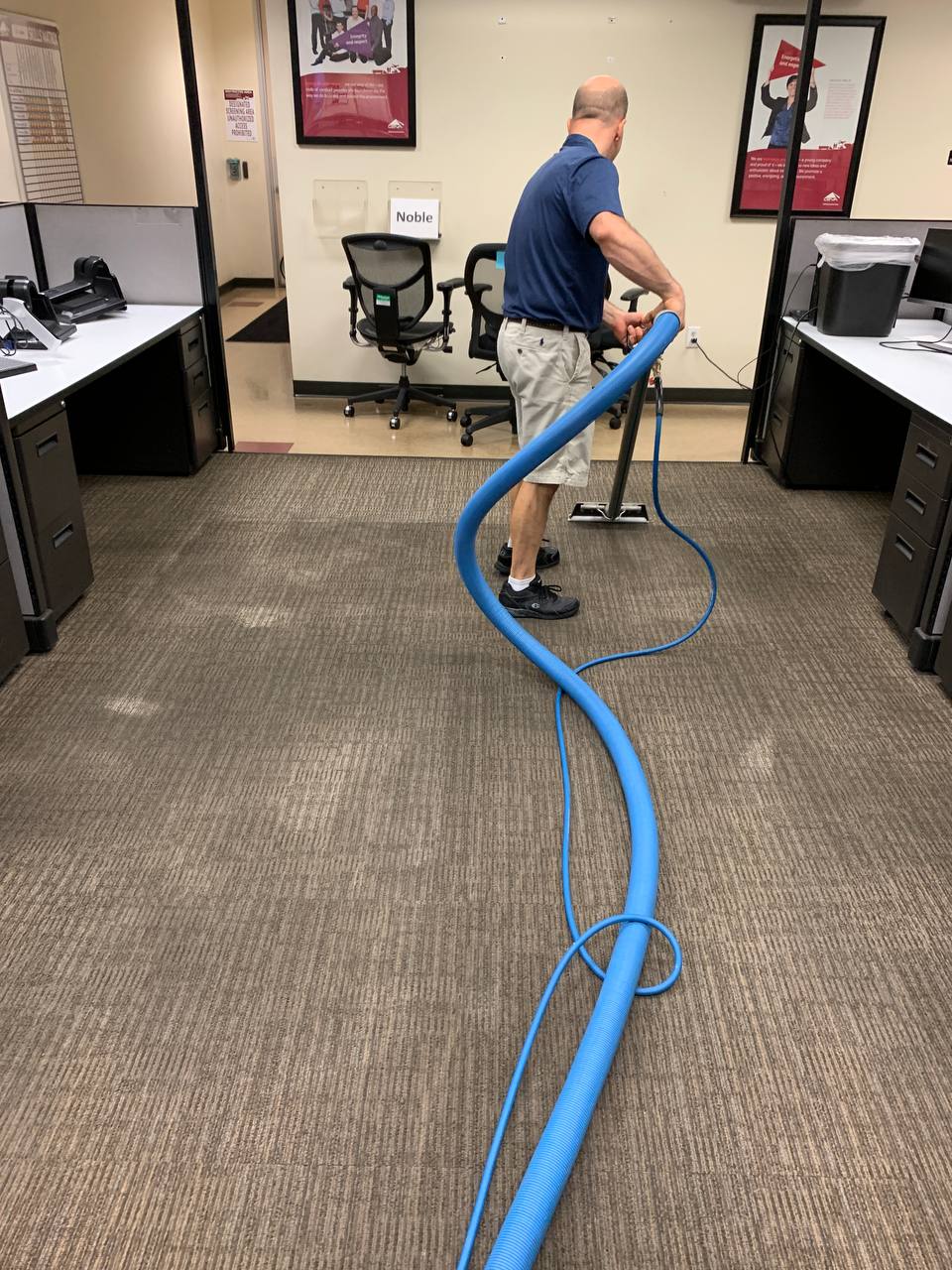 Three Scott's Carpet Care vans at a large commercial property
